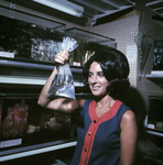 Woman Holding Bag of Fish for Master Packaging, A by George Skip Gandy IV