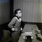 Woman Speaking at Table for Aero Mayflower Transit Company Incorporated, B by George Skip Gandy IV