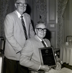 Man in Wheelchair Holding Plaque at Memorial Hospital in Tampa by George Skip Gandy IV