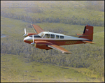 Twin Bonanza Plane Flies Over Marsh Landscape in Opa-locka, Florida, I