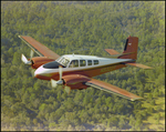 Twin Bonanza Plane Flies Over Marsh Landscape in Opa-locka, Florida, L