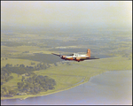 Twin Bonanza Plane Flies Over Coastline in Opa-locka, Florida, E