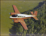 Twin Bonanza Plane Flies Over Marsh Landscape in Opa-locka, Florida, Z