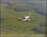 Twin Bonanza Plane Flies Over Marsh Landscape in Opa-locka, Florida, AC