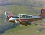 Twin Bonanza Plane Flies Over Marsh Landscape in Opa-locka, Florida, AF