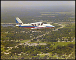 Piper PA-23-250 Aztec in flight through fog, A