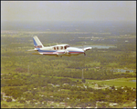 Piper PA-23-250 Aztec in flight through fog, B