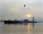 Tugboat Dixie Commander with Attached Dredge at Sunrise, Tampa Bay, Florida by George Skip Gandy IV