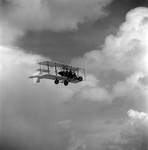 Biplane with Pilot and Passenger in Flight, Tampa, Florida, A by George Skip Gandy IV