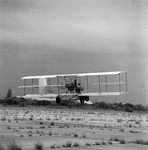 Biplane Taking Off from Runway, Tampa, Florida by George Skip Gandy IV