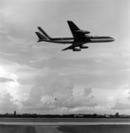 Biplane and Commercial Airplane in Flight Over Runway, Tampa, Florida, C by George Skip Gandy IV