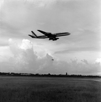 Biplane and Commercial Airplane in Flight Over Runway, Tampa, Florida, D by George Skip Gandy IV