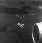 Two Aircraft Flying Over Rural Landscape, Tampa, Florida, A by George Skip Gandy IV