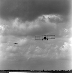 Biplane and Commercial Airplane in Flight Over Runway, Tampa, Florida, F by George Skip Gandy IV