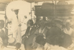 Group Seated on Ferry, B