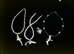 Two Shark Necklaces, a Shark Ring, and a Bird Necklace, C by Skip Gandy