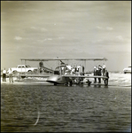 Group of Men Observing Benoist Flying Boat Preparing to Launch From Shore by Skip Gandy
