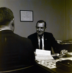 Exchange National Bank Representative with Client, A by George Skip Gandy IV