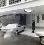 Exchange National Bank 1965 Ford Mustang Coupe Driving into Parking Garage, C by George Skip Gandy IV