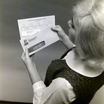 Exchange National Bank Woman Holding Bank Statement, Tampa, I by George Skip Gandy IV
