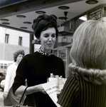 Company Representative Speaks to Woman on Street, Exchange National Bank by George Skip Gandy IV