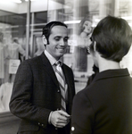Company Representative Speaks to Man on Street, Exchange National Bank by George Skip Gandy IV