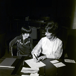 Jean Eason Fills Out Form with Child, Exchange National Bank by George Skip Gandy IV