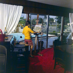 Woman Painting a Canvas Near Pool, Exchange National Bank by George Skip Gandy IV