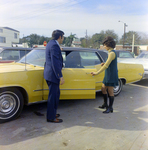 Woman Entering Vehicle Near Man, Exchange National Bank by George Skip Gandy IV