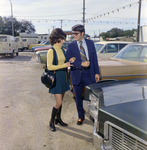 Man and Woman View Lincoln Continental at Lot, Exchange National Bank by George Skip Gandy IV