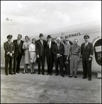 People in Front of a Plane, B