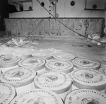 Stacks of International Newsprint rolls on a Ship, B by George Skip Gandy IV