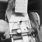 Person Inspecting the Parts of a Dennison Dial Set Printer, B by George Skip Gandy IV