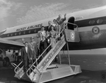 Passengers Deboarding a Mackey Airlines Flight, A by George Skip Gandy IV