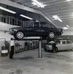 Technician Works under Volvo on Lift at Kennedy Strickland Motor Company, A by George Skip Gandy IV