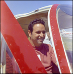 Man Smiling From Inside Plane at Aviation Expo by Skip Gandy