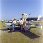 People Standing in Front of Plane at Aviation Expo by Skip Gandy