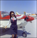 Woman in Front of Plane at Aviation Expo by Skip Gandy