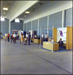 A Row of Booths in the Plane Hanger at Aviation Expo by Skip Gandy