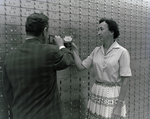 Man and Woman at Lock Boxes at Tampa Marine Bank, A by George Skip Gandy IV