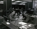 Executive Working with Family at Tampa Marine Bank by George Skip Gandy IV