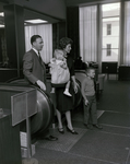 Family at Escalator at Tampa Marine Bank by George Skip Gandy IV