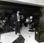 Man Speaking on Stage at Party for Marling Group and Westshore 500, B by George Skip Gandy IV