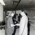Man and Woman Shaking Hands at Party for Marling Group and Westshore 500 by George Skip Gandy IV