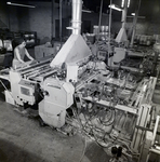 People Using Packaging Machines for Master Packaging, G by George Skip Gandy IV