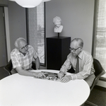 Two Men with Tampa Performing Arts Center Booklet at Walker & McLane, A by George Skip Gandy IV