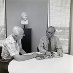 Two Men with Tampa Performing Arts Center Booklet at Walker & McLane, D by George Skip Gandy IV