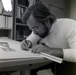 Man Working at Desk at Walker & McLane in Tampa, A by George Skip Gandy IV