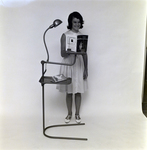 Woman Standing with Lamp and Stand for Mechanical Interprises, B by George Skip Gandy IV