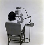 Woman Sitting with Lamp and Stand for Mechanical Interprises, A by George Skip Gandy IV